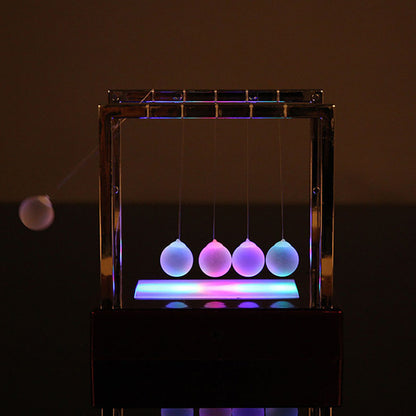 Illuminated Love Newton's Cradle